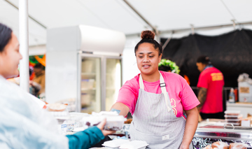 127812 Pasifika Woman Serving Food To Female Customer